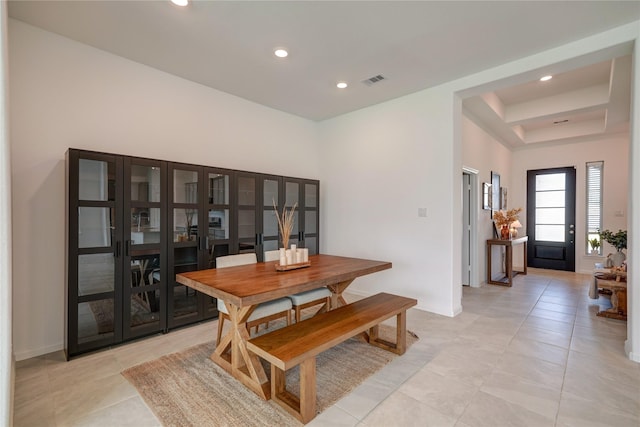 dining area featuring visible vents, recessed lighting, a raised ceiling, and light tile patterned floors