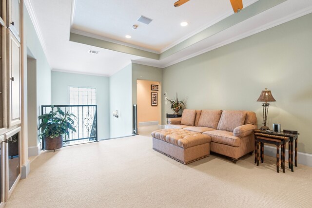 392 Green Cove Dr, Montgomery, TX 77356 - living area featuring visible vents, ornamental molding, recessed lighting, a tray ceiling, and carpet flooring