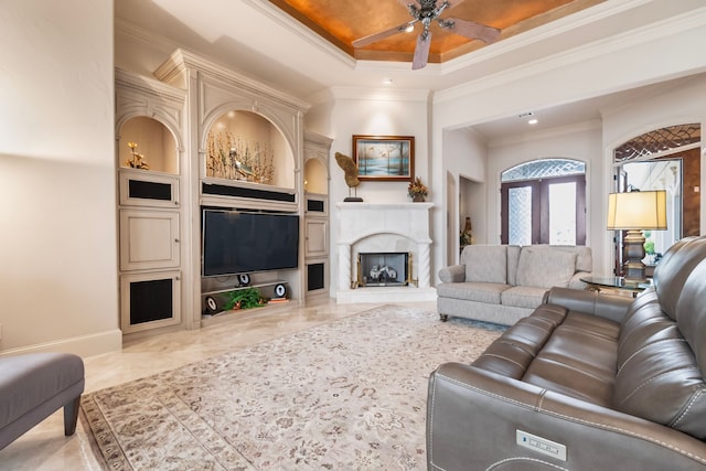 392 Green Cove Dr, Montgomery, TX 77356 - living area featuring crown molding, built in features, baseboards, and a ceiling fan