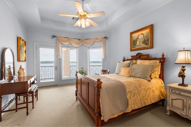 392 Green Cove Dr, Montgomery, TX 77356 - bedroom featuring ornamental molding, light carpet, access to exterior, ceiling fan, and a raised ceiling