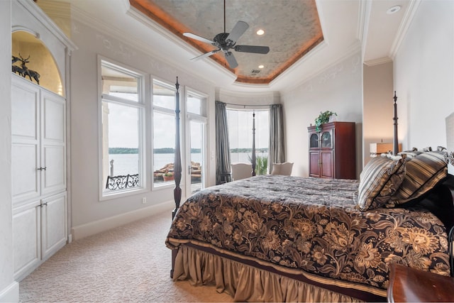 392 Green Cove Dr, Montgomery, TX 77356 - carpeted bedroom with crown molding, a raised ceiling, a water view, and multiple windows
