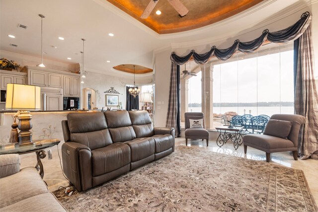392 Green Cove Dr, Montgomery, TX 77356 - living area featuring visible vents, ornamental molding, ceiling fan, recessed lighting, and a tray ceiling