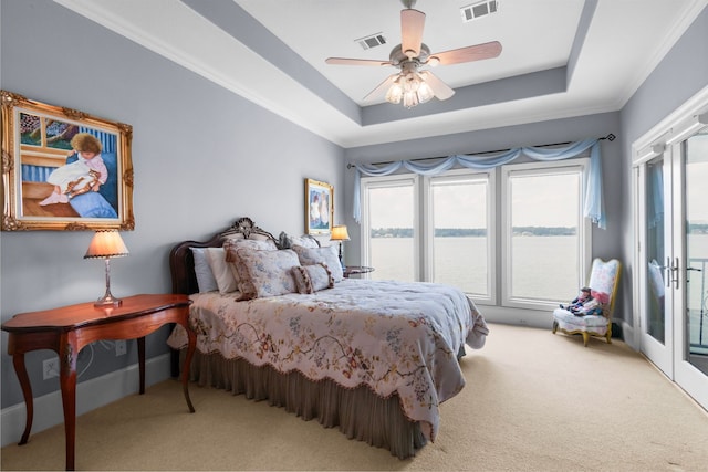 392 Green Cove Dr, Montgomery, TX 77356 - bedroom with carpet floors, a tray ceiling, visible vents, and access to exterior