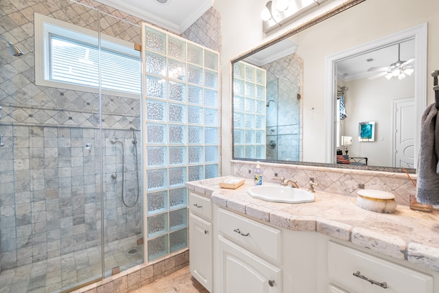 392 Green Cove Dr, Montgomery, TX 77356 - full bath with vanity, ornamental molding, a ceiling fan, and a shower stall