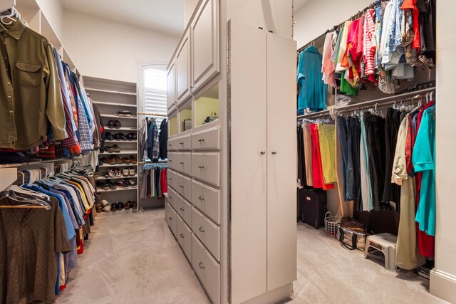 392 Green Cove Dr, Montgomery, TX 77356 - walk in closet featuring light colored carpet