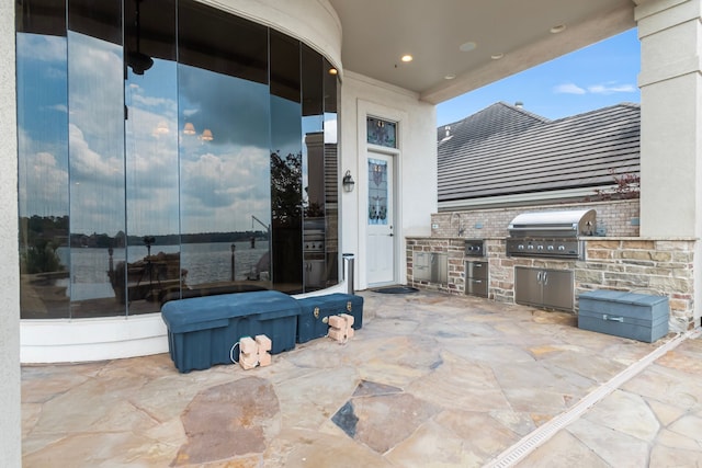 392 Green Cove Dr, Montgomery, TX 77356 - view of patio / terrace with a sink, exterior kitchen, and grilling area