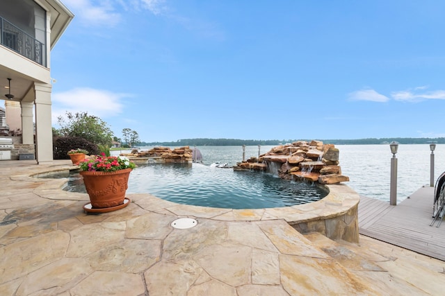 392 Green Cove Dr, Montgomery, TX 77356 - view of pool featuring a water view and an outdoor kitchen