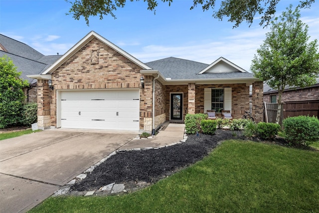 ranch-style house featuring a garage, fence, roof with shingles, brick siding, and concrete driveway