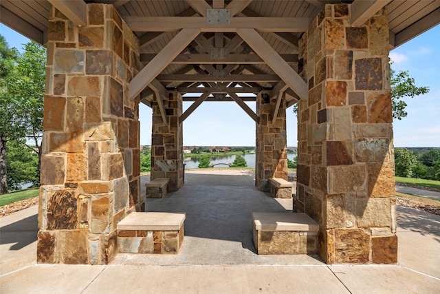 view of community with a gazebo and a water view