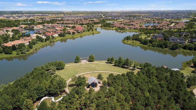 birds eye view of property featuring a water view and a residential view