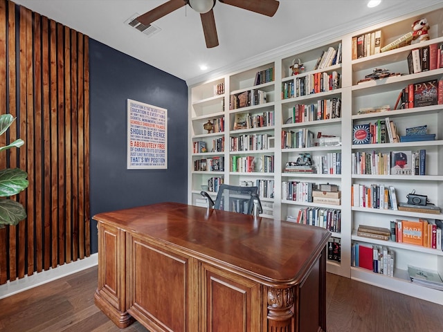 office with visible vents, ceiling fan, dark wood-style floors, and built in shelves