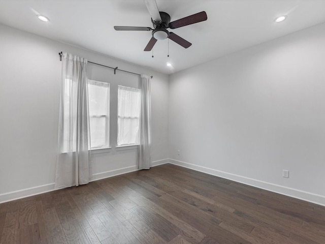 unfurnished room featuring a ceiling fan, baseboards, recessed lighting, and dark wood-style floors