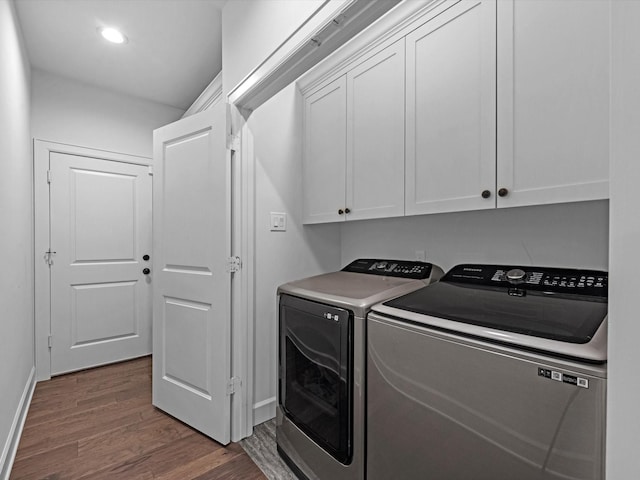 laundry room with baseboards, dark wood-style floors, recessed lighting, washing machine and clothes dryer, and cabinet space