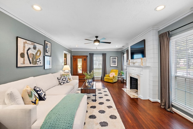 living area with ceiling fan, ornamental molding, recessed lighting, and wood finished floors