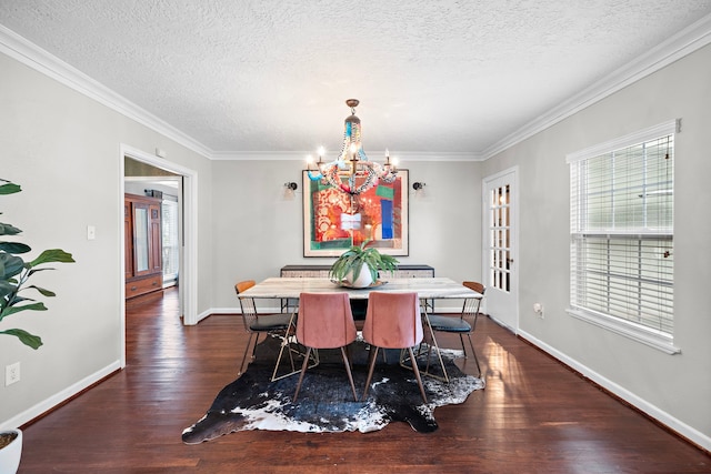 dining room featuring baseboards, dark wood-style flooring, a textured ceiling, and a notable chandelier