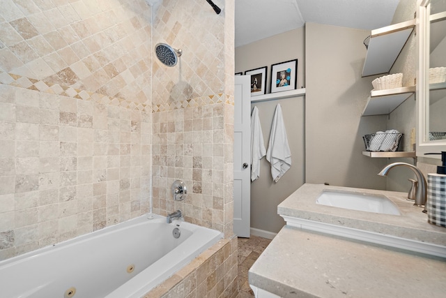 full bathroom with baseboards, a combined bath / shower with jetted tub, and vanity