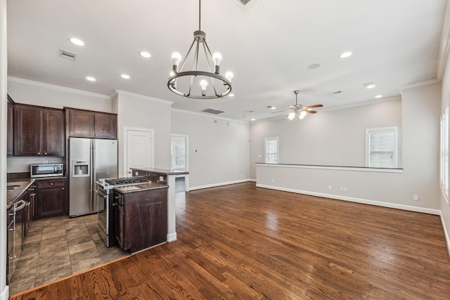 kitchen featuring recessed lighting, ceiling fan with notable chandelier, dark countertops, and stainless steel appliances
