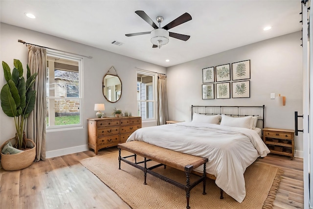 bedroom with visible vents, baseboards, recessed lighting, a ceiling fan, and light wood-style flooring