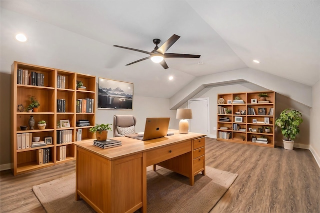 home office with light wood-style flooring, a ceiling fan, baseboards, recessed lighting, and vaulted ceiling