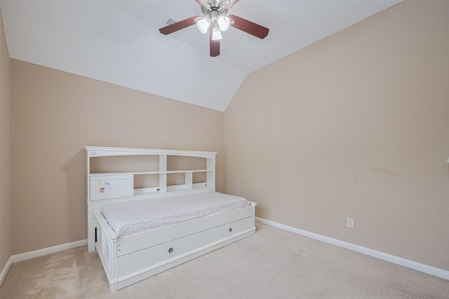 bedroom featuring ceiling fan, visible vents, baseboards, lofted ceiling, and light carpet