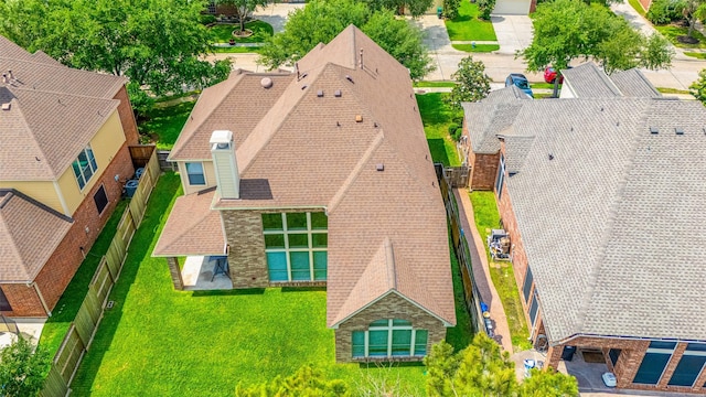 birds eye view of property with a residential view