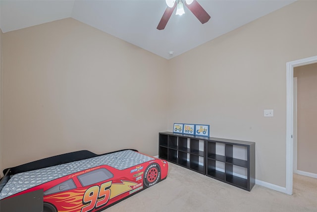 bedroom featuring baseboards, carpet, a ceiling fan, and lofted ceiling