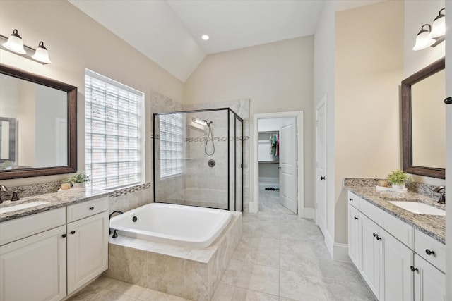 27018 Camirillo Creek Ln, Katy, TX 77494 - bathroom featuring a sink, a shower stall, a bath, and lofted ceiling