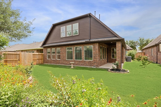 27018 Camirillo Creek Ln, Katy, TX 77494 - rear view of property with central air condition unit, a patio, a fenced backyard, and brick siding