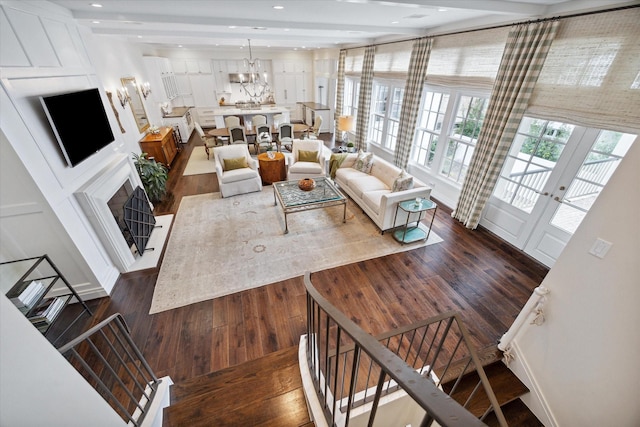 56 Audubon Hollow Ln, Houston, TX 77027 - living area featuring a fireplace, recessed lighting, a notable chandelier, and dark wood-type flooring
