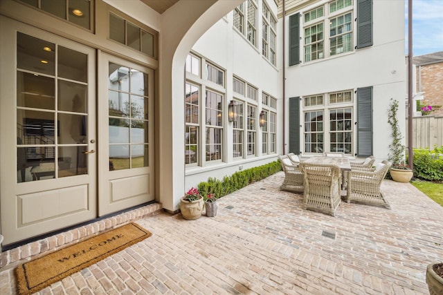 56 Audubon Hollow Ln, Houston, TX 77027 - view of patio featuring french doors and outdoor dining space