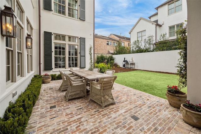 56 Audubon Hollow Ln, Houston, TX 77027 - view of patio featuring a fenced backyard, outdoor dining space, and a residential view