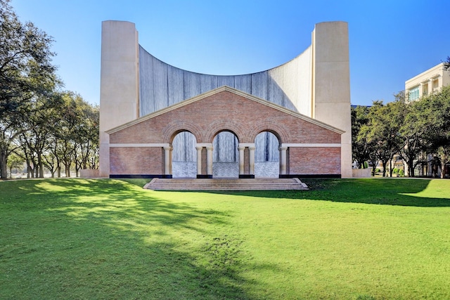 56 Audubon Hollow Ln, Houston, TX 77027 - exterior space featuring a chimney and a front lawn