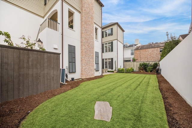 56 Audubon Hollow Ln, Houston, TX 77027 - view of yard featuring central AC, fence private yard, and a balcony