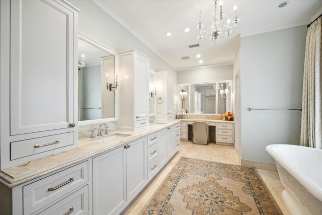 56 Audubon Hollow Ln, Houston, TX 77027 - full bathroom with double vanity, a freestanding tub, visible vents, and a sink
