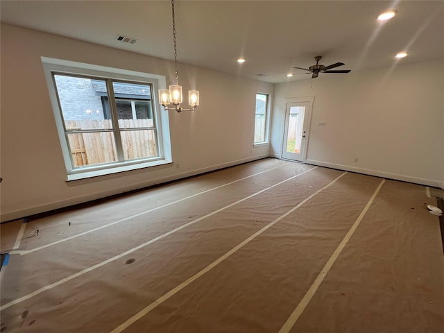 unfurnished dining area with baseboards, ceiling fan with notable chandelier, recessed lighting, and visible vents