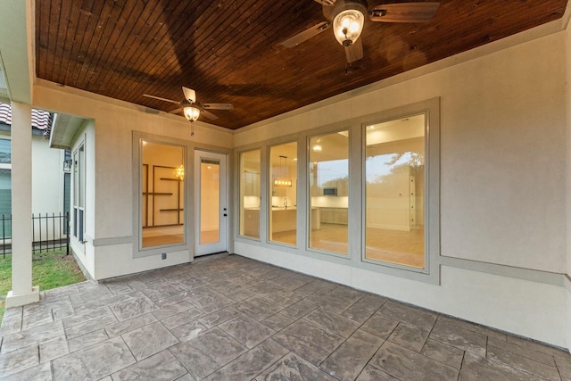 view of patio featuring fence and a ceiling fan