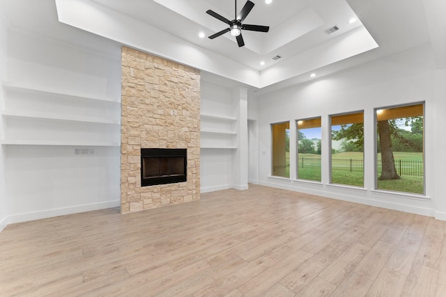 unfurnished living room with ceiling fan, recessed lighting, wood finished floors, and visible vents