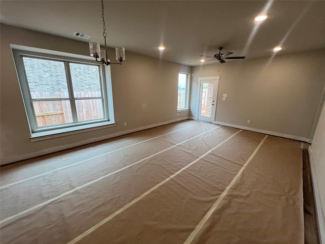 interior space with visible vents, recessed lighting, baseboards, and ceiling fan with notable chandelier