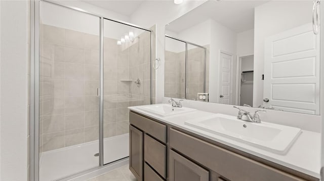 bathroom featuring a sink and a shower stall