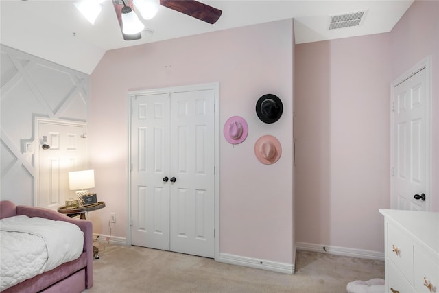 bedroom featuring ceiling fan, visible vents, baseboards, a closet, and light carpet