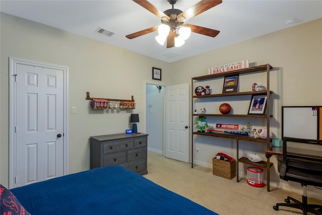 bedroom with light colored carpet, a ceiling fan, visible vents, and baseboards