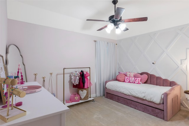 bedroom with ceiling fan and light colored carpet