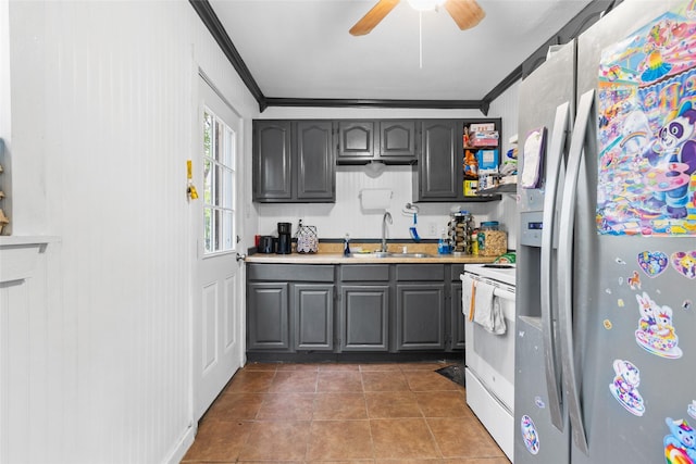 925 New Laredo Hwy, San Antonio, TX 78211 - kitchen with gray cabinets, electric range, crown molding, a sink, and stainless steel fridge