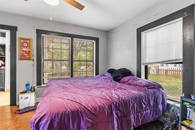925 New Laredo Hwy, San Antonio, TX 78211 - tiled bedroom with a textured wall and ceiling fan