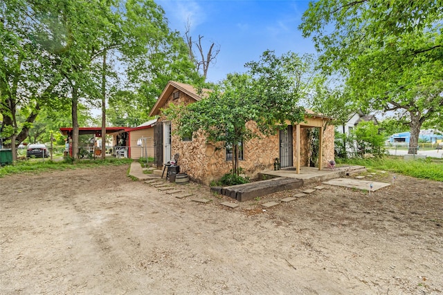 925 New Laredo Hwy, San Antonio, TX 78211 - rear view of property featuring fence and stone siding