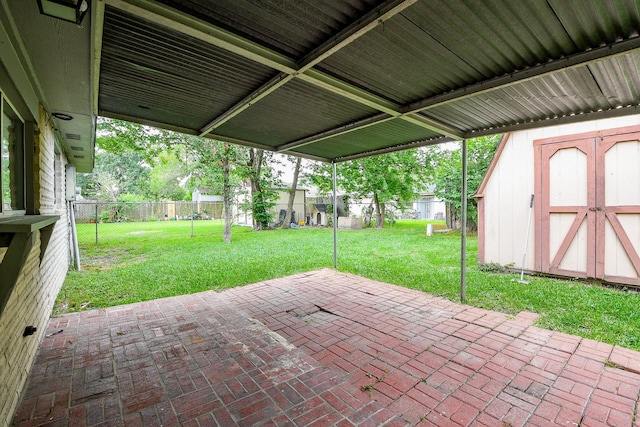 view of patio / terrace featuring a storage shed, an outdoor structure, and a fenced backyard