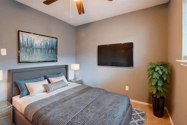 bedroom featuring baseboards, carpet, and ceiling fan