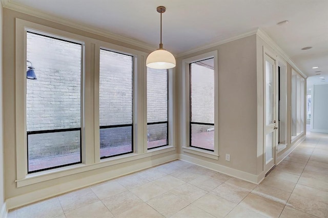 unfurnished dining area featuring baseboards, ornamental molding, and light tile patterned floors