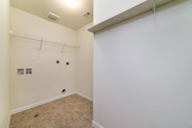 clothes washing area featuring laundry area, visible vents, baseboards, electric dryer hookup, and washer hookup