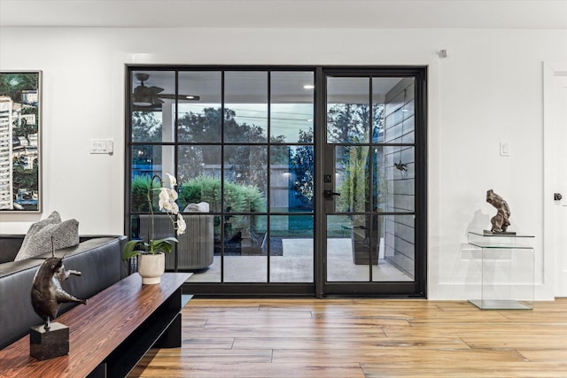 doorway to outside featuring wood finished floors
